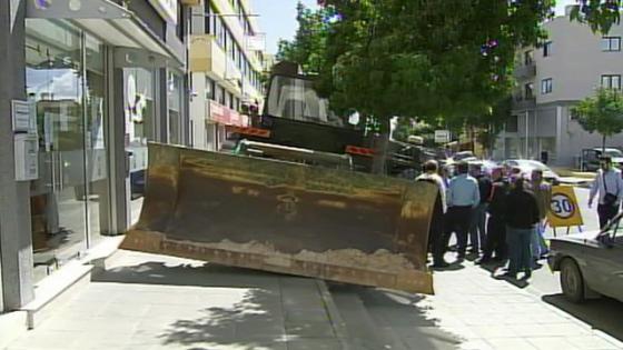 Cyprus bailout Man threatens bank with bulldozer